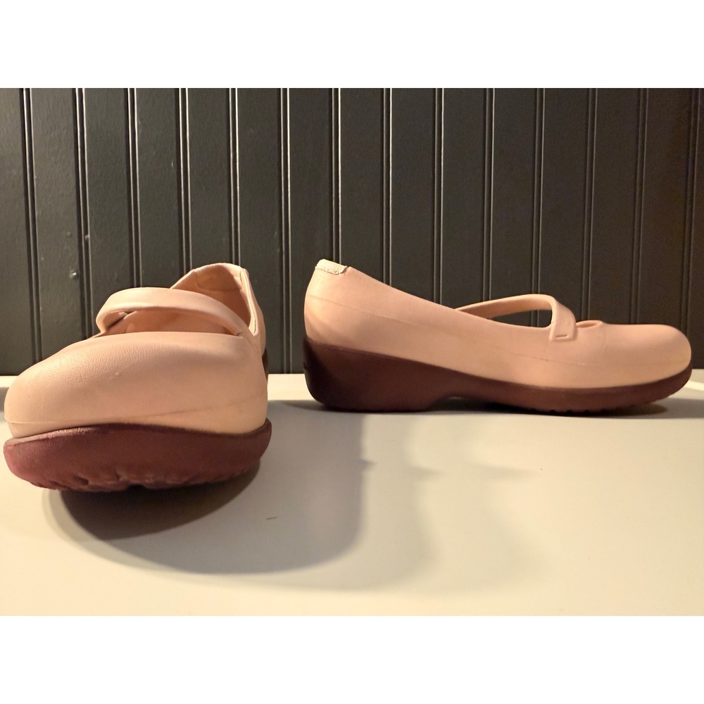 Crocs pink Mary Jane comfort shoes featuring a contrasting burgundy wedge